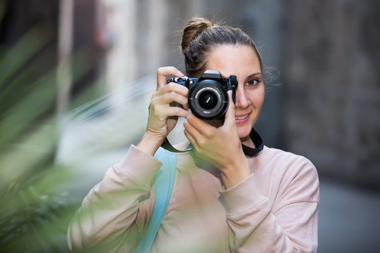  woman taking snapshots