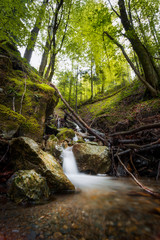 Waterfall in Logar Valley between snowy mountains forest in Spring vacation tourist, Logarska dolina, Slovenia&nbsp;