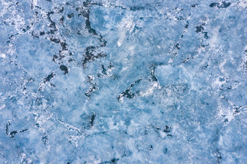 Aerial view of frozen lake. Drone view. Background texture concept.