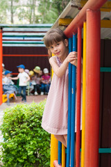 Fototapeta na wymiar Girl on the playground in kindergarten