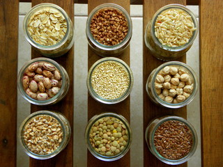 A collection of cereals and legumes on a wooden table