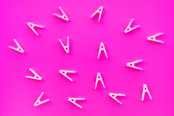 clothespins on pastel color background