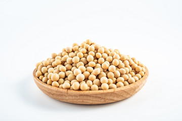 Soybean soybeans dried on a saucer on a white background