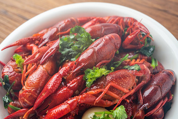 Chinese dish with a bowl of bright red delicious spicy crayfish