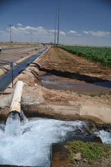 Arizona irrigation water discharge pipe and canal