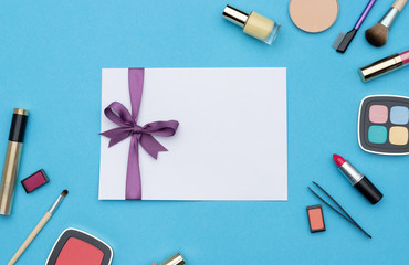 Various cosmetics around gift certificate