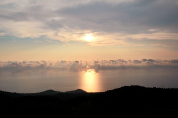 Sea, sky, beautiful structure of clouds, majestic landscape with seascape at calm sunset on horizon of mediterranean coast. Amazing sunset vibes on edge ocean. Sunrise over sea, natural environment.