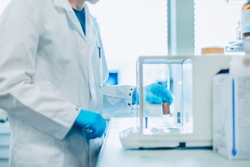 Scientist conducting an experiment in a lab