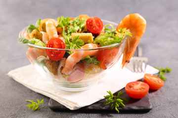 shrimp salad in bowl with tomato and lettuce