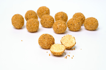 Milk truffles in mustard seeds