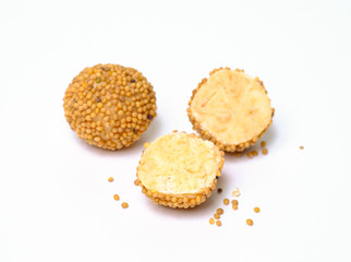 Milk truffles in mustard seeds