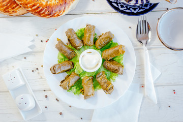 Top view of dolma - asian dish made with grapes leaves and meat.