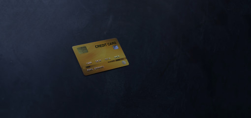 Many credit cards are placed on the Black marble floor.