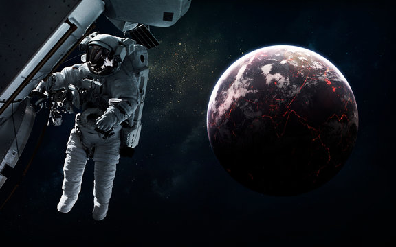 Astronaut at deep space. Science fiction wallpaper. Elements of this image furnished by NASA