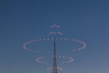 Chandelier Light Reflections on City Antenna Tower. UFO Concept. Abstract Geometric Background.