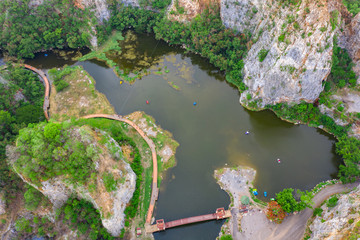 aerial over view khao ngoo mountain rock or snake mountain rock are high cliff and landmark ratchaburi province thailand