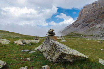 Stone pyramid on a hiking trail in the mountains