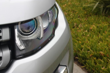 Silver luxury SUV headlight