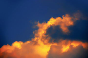 Fototapeta na wymiar Blurry Background image of dramatic twilight golden clouds on night sky.
