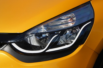 Yellow hot hatchback headlight