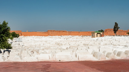 The traditional Jewish old cemetery of Marrakesh, Morocco is filled with tombs painted with white paint.