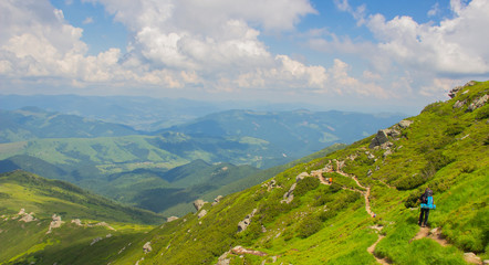 Naklejka premium Hiking with a tent through Petros to Hoverla, Lake Nesamovite, Mount Pop Ivan Observatory.