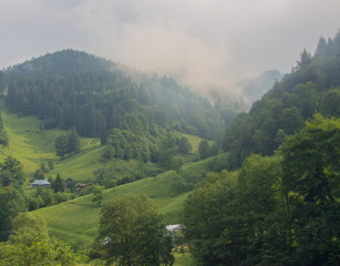 Fototapeta premium Hiking with a tent through Petros to Hoverla, Lake Nesamovite, Mount Pop Ivan Observatory.
