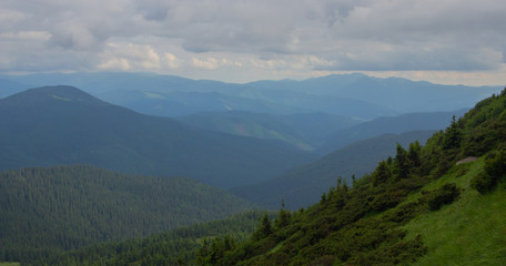 Fototapeta premium Hiking with a tent through Petros to Hoverla, Lake Nesamovite, Mount Pop Ivan Observatory.