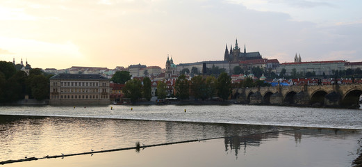 Evening view of Prague from the right bank of the Vltava river from Charles Bridge.