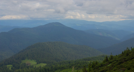 Fototapeta premium Hiking with a tent through Petros to Hoverla, Lake Nesamovite, Mount Pop Ivan Observatory.