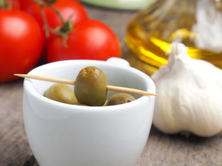 Tasty green olives in a kitchen