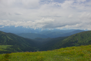 Naklejka premium Hiking with a tent through Petros to Hoverla, Lake Nesamovite, Mount Pop Ivan Observatory.