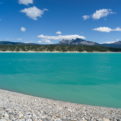 Scenic view of Abraham Lake with mountains in the background, David Thompson Highway, Clearwater County, Alberta, Canada