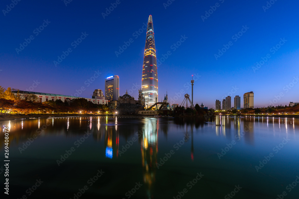 Wall mural Twilight sunset at Seokchon Lake with city in Seoul ,South Korea.