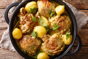 Kari ayam is the Indonesian take on chicken curry closeup on a pan. horizontal top view