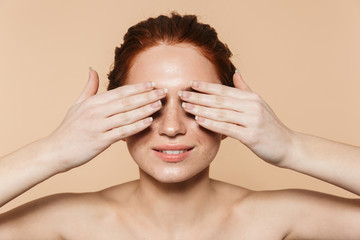 Pretty young cheerful redhead woman.