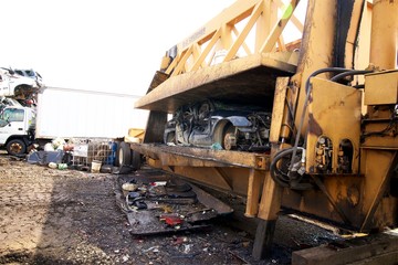 smashing cars at the junkyard car crushing