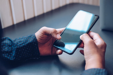 man holding using smart mobile phone