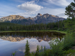 Reflection of mountain in North Saskatchewan River, David Thompson Highway, Clearwater County, Alberta, Canada - 269410051