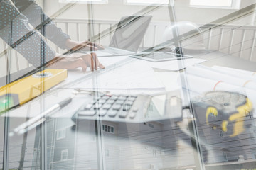 architect engineer working on house blueprint of real estate project. building construction concept.