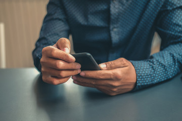 man holding using smart mobile phone