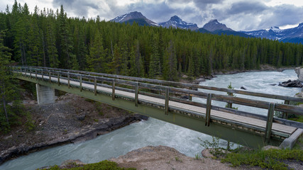 Fototapeta na wymiar Bridge across river, Saskatchewan River Crossing, Icefields Parkway, Jasper, Alberta, Canada