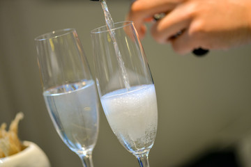 two glasses of champagne on table