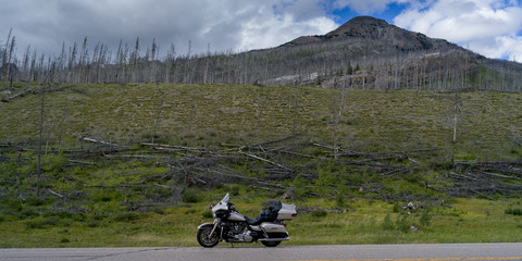 Motorcycle parked at roadside, David Thompson Highway, Clearwater County, Alberta, Canada