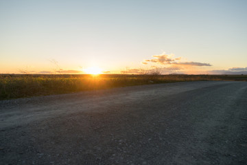 sunset at a path with clear sky