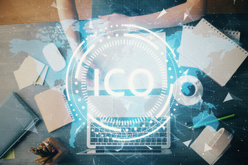 Cryptocurrency hologram over hands taking notes background. Concept of blockchain. Multi exposure