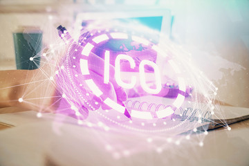 Cryptocurrency hologram, bitcoin, ico theme over hands taking notes background. Concept of blockchain. Multi exposure