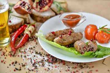 grilled sausages with tomatoes and ketchup