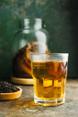 Kombucha tea on rustic background