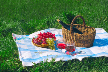 red wine and fruit basket , picnic  and summer vacation concept